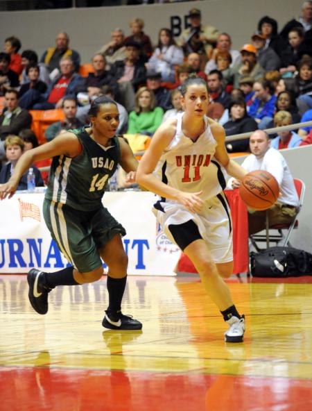 Kaitlin Dudley goes in for a layup in the first round of the NAIA national tournament. - Photo by Morris Abernathy