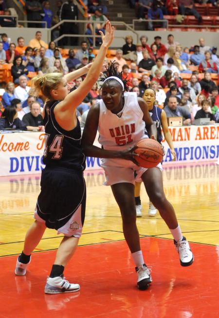 Junior Josephine Owino goes up for a shot in the second round of the NAIA national tournament. - Photo by Morris Abernathy