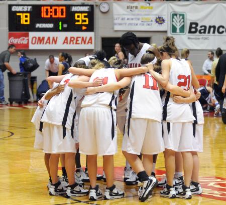 The Lady Bulldogs pray after defeating The Master's College (Calif.) during the second round of the NAIA national tournament.  They won 95-78. - Photo by Morris Abernathy