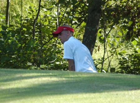 Mickey Armstrong look at the flag as he prepares to take a shot from off the green. - Photo by Steven Aldridge