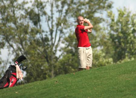 Clay Mallard watches his shot from the fairway. - Photo by Steven Aldridge