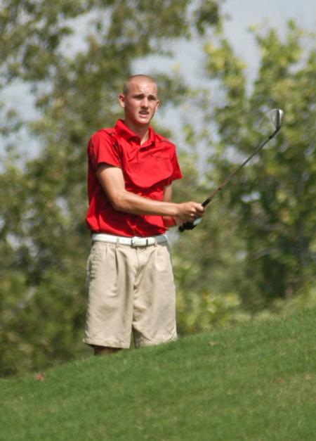 Clay Mallard watches as his shot from the fairway approaches the green. - Photo by Steven Aldridge