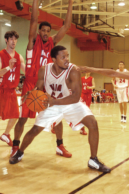 Junior Derrick Underwood looks for assistance from his teammates while cornered by Martin Methodist. - Photo by Justin Veneman