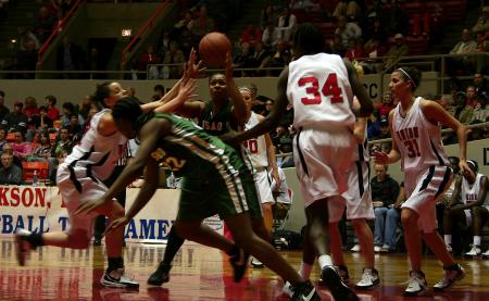 Players from Union University and the University of Sciences and Arts battle for the ball during the first round game of the NAIA tournament.  the Lady Bulldogs would go on to win the game. - Photo by Kristi McMurry Woody