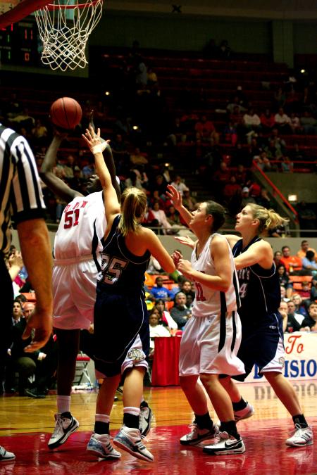 Josephine Owino goes up for a shot while her opponents try desperately to block her.  The Lady Bulldogs defeated The Master's during the second round of the NAIA tournament. - Photo by Kristi McMurry Woody