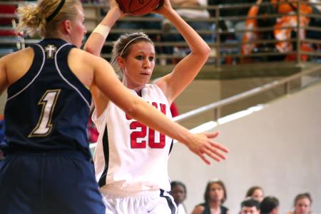 Kayla Hudson looks for someone to pass to during the second round game of the NAIA tournament against The Master's. - Photo by Kristi McMurry Woody