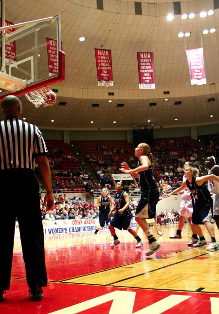 Players from Union University and The Master's watch as a shot goes in to put the Lady Bulldogs up by two more points.   - Photo by Kristi McMurry Woody
