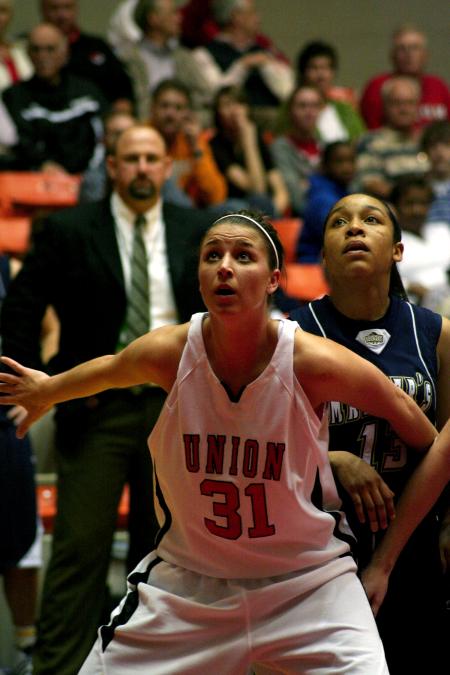 Merideth Richardson Jacobs boxes out under the basket during the second round game of the NAIA tournament against The Master's. - Photo by Kristi McMurry Woody