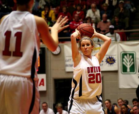 Kayla Hudson prepares to throw the ball to her teammate, Kaitlin Dudley, during the second round of the NAIA tournament. - Photo by Kristi McMurry Woody