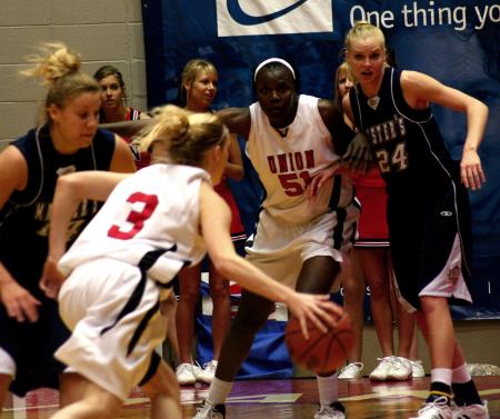 Crystal Eason makes a drive to the basket during the second round game of the NAIA tournament against The Master's. - Photo by Kristi McMurry Woody