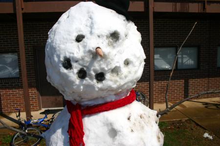 Snow covered Union's campus the night of Mar. 7, and students took a break from studying to play in it.  A ten foot snow man stands in front of Rogers in McAfee. - Photo by Stephanie Schroeder