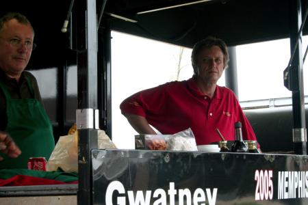 Russell Gwatney and Rick Dalton, head cook, of the Gwatney Chevrolet team stand in their trailer while cooking barbeque for Union University faculty, staff, and students. - Photo by Kristi McMurry Woody