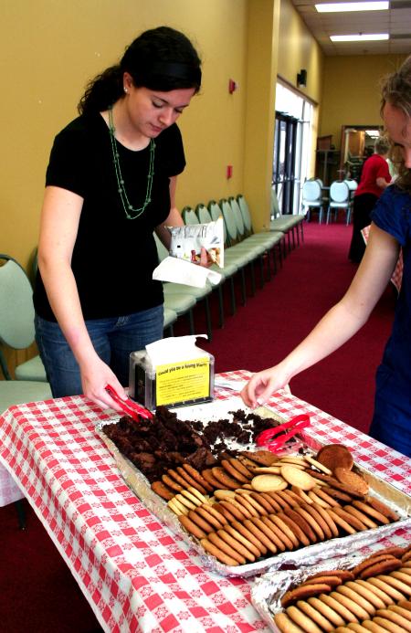 Kayla McKinney, sophomore learning foundations major, gets a cookie at the dessert table during the barbeque lunch provided and prepared by the team at Gwatney Chevrolet. - Photo by Kristi McMurry Woody