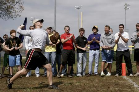 Fraternities competing in the ball throw at the Greek Olympics. - Photo by Kyle Kurlick
