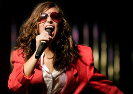 Junior Rachael Moore, english major, performs with the Chi Omega group during the 2008 Variety Show. The show's theme this year was British Invasion and groups sang or danced to songs by British rock bands. - Photo by Kyle Kurlick