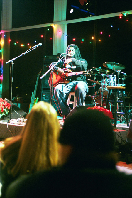 Christian music artist Jason Eskridge explains one of his songs to students during WatterStock 2002. - Photo by Justin Veneman