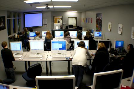 Students on the Cardinal and Cream staff work on the paper in the temporary DMS lab.  The DMS lab will be moved back to Jennings Hall when construction is completed in the fall. - Photo by Kristi McMurry Woody