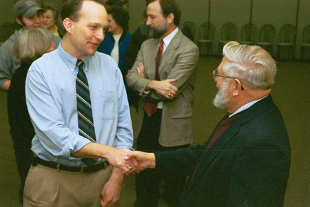 Reference Librarian John Jaeger greets Scholar-in-Residence James Sire during a reception for Dr. Sire, the former Senior Editor of InterVarsity Press. - Photo by Jim Veneman
