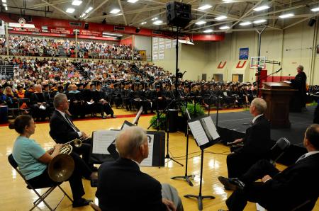President Dockery delivers the commencement charge to the new graduates during the summer graduation ceremony in Union's Fred DeLay Gymnasium. - Photo by Jim Veneman