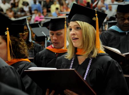 Megan Clampitt, of Jackson, Tenn., the first recipient of Union's Master of Science in Nursing - nurse anesthesia degree, sings the Alma Mater at the close of the Aug. 2 graduation ceremony held on Union's campus. - Photo by Jim Veneman