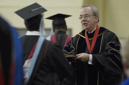 President Dockery hands out diplomas during summer graduation in the Fred DeLay Gymnasium Saturday, August 2, 2008. - Photo by Justin Veneman