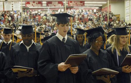 (Front L-R) Chidi Akpa, Jared Barnes, Kowania Brown and Susan Cossar sing the Alma Mater during Union University's graduation ceremony at the Fred DeLay Gymnasium on Saturday August 2, 2008. - Photo by Justin Veneman