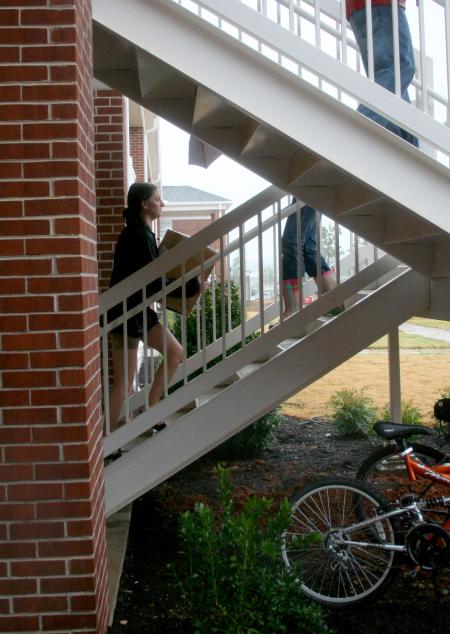 Kristin Dutt, junior business administration major, carries a box up the stairs of Ayers 3 on the day that Union's newest students moved into the new residence life complex. - Photo by Kristi McMurry Woody