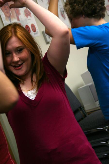 Freshman Caroline Rickard plays the name dance game with her Focus group. - Photo by Kristi McMurry Woody