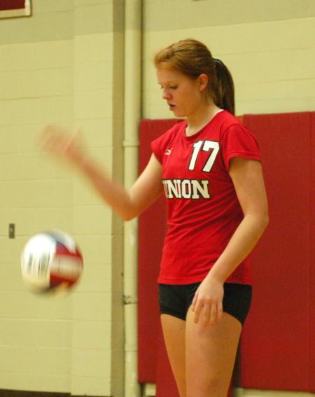 Anna Sims prepares to serve. - Photo by Steven Aldridge