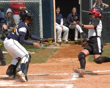 Candace Cross gets set to slide into home as she looks to avoid the coming tag. - Photo by Steven Aldridge