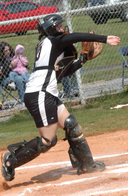 Candice Thompson throws down to second base as she tries to stop a runner from stealing. - Photo by Steven Aldridge