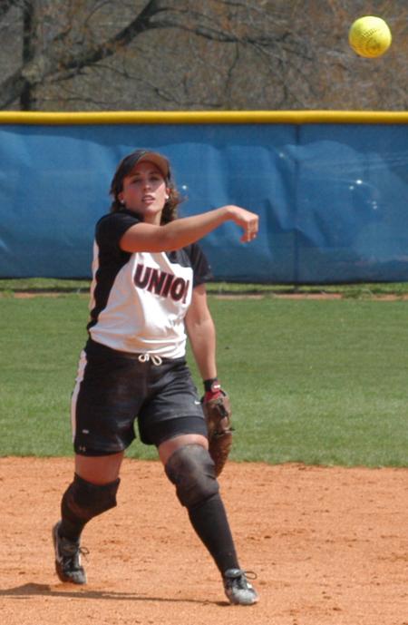 Candace Cross tosses the ball, from her position at second base, over to first base. - Photo by Steven Aldridge
