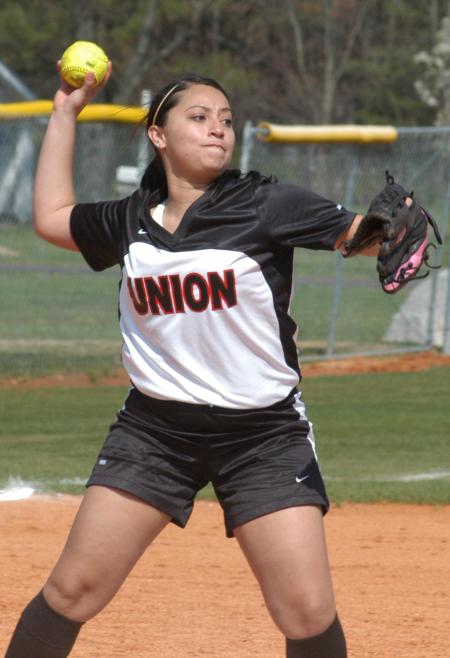 Stephanie Hernandez turns and throws to first base, after fielding a ball hit back to the pitcher. - Photo by Steven Aldridge