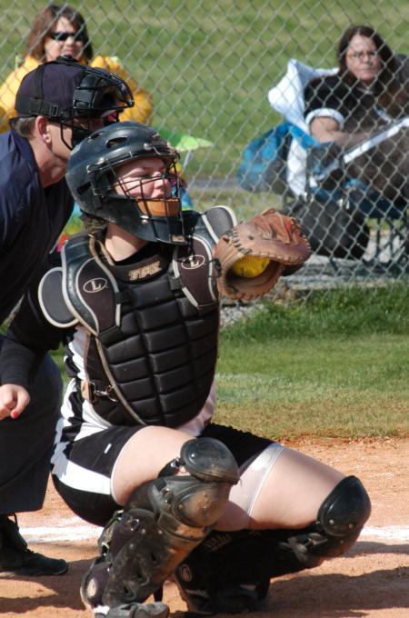 Candice Thompson catches a high pitch. - Photo by Steven Aldridge