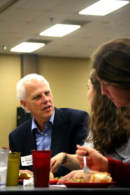 Stephen Carls, chair of the department of history, talks with Julianne Little and Megan Winters at the dinner with your department event during new student orientation. - Photo by Kristi McMurry Woody