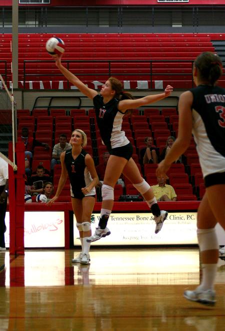 Anna Sims, freshman, hits the ball over the net during a match against Martin Methodist.  The Lady Bulldogs won the match 3-0. - Photo by Kristi McMurry Woody