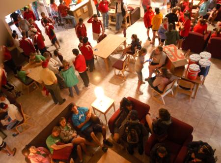 Faculty, staff, current students and returning students gather in McAfee commons waiting to help the new students. - Photo by Angela Abbamonte