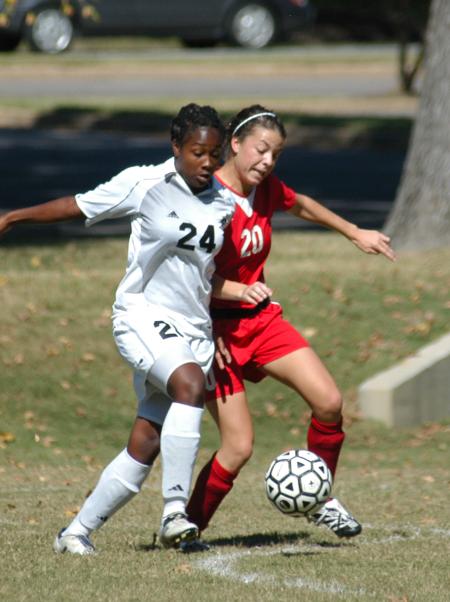 Jill Landers works against Crichton players for possession of the ball. - Photo by Steven Aldridge