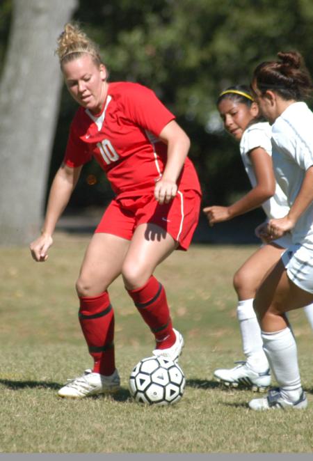 Cheslie Tharpe works the ball around two Crichton defenders. - Photo by Steven Aldridge