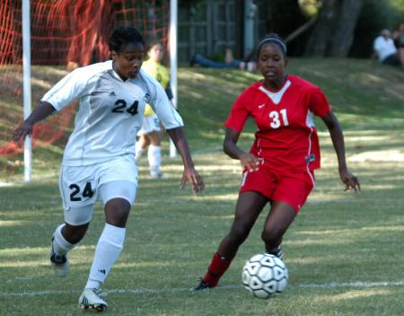 Eboni Murphy (31) tries to keep the ball from a Crichton defender. - Photo by Steven Aldridge