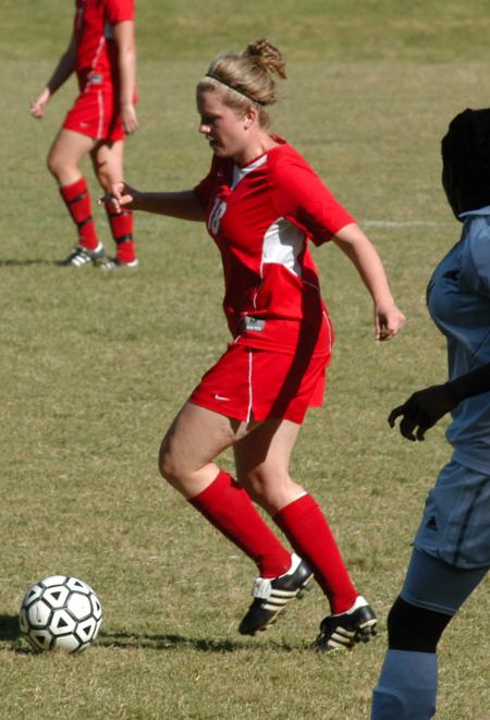 Candice Blackard controls the ball with defenders in close range. - Photo by Steven Aldridge