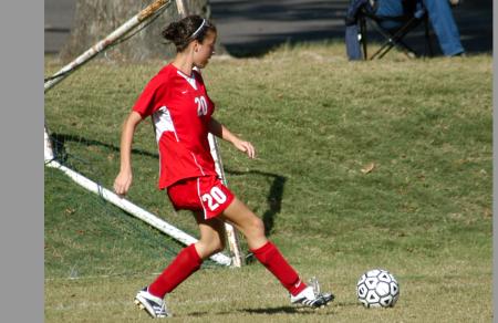Jill Landers advances the ball to one of her teammates. - Photo by Steven Aldridge