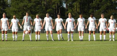 The starters for Union stand during the pre-game prayer and National Anthem. - Photo by Steven Aldridge