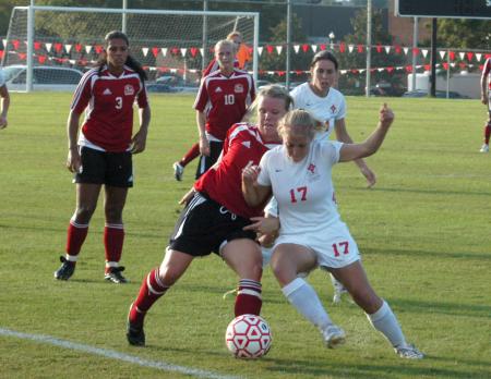 Abigail Williams works to hold off a defender as they battle for possession. - Photo by Steven Aldridge
