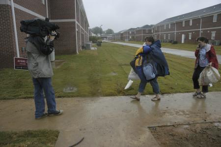 Local news stations came to cover Union's move-in day and watch as families walked with both arms full to the new residence complex. - Photo by Jordan Buie