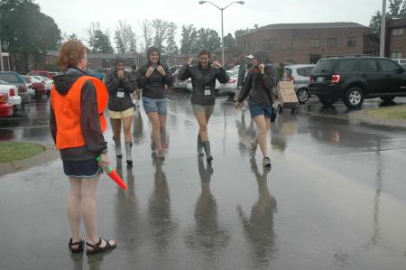 Lily Zopfi stands ready to direct freshman traffic as Haley Gallagher, Mallory Carter, Kari Beougher and Tiffany Fredericks dawn the hoods of their rain jackets - a gift for Focus leaders that turned out to be very useful while helping with freshman move-in.  - Photo by Beth Spain