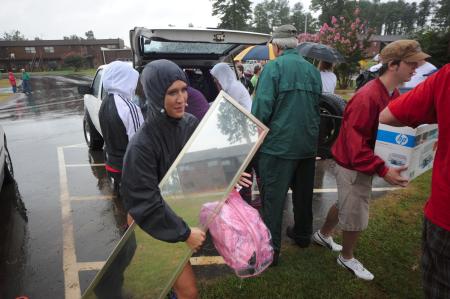Volunteers made moving in a quick task during freshman move-in day. - Photo by Morris Abernathy