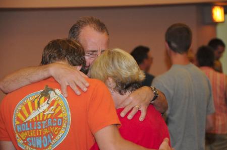 Parents pray with their student as they say goodbye after the Focus evening worship service. - Photo by Morris Abernathy