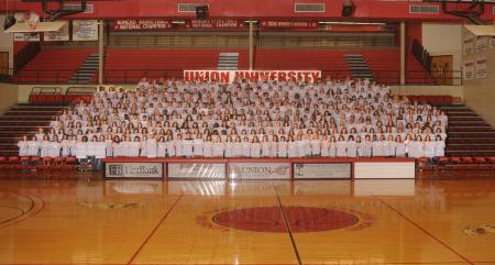 The Class of 2012 poses for a group shot in the Fred DeLay Gymnasium. - Photo by Morris Abernathy