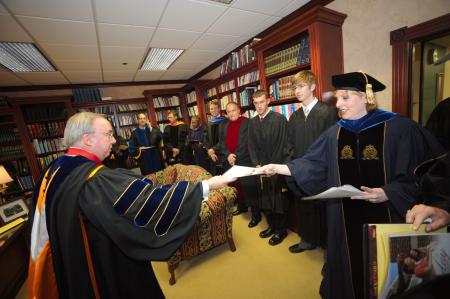 Before fall convocation, President Dockery assembles the service participants in his office to go over final details. - Photo by Morris Abernathy